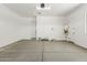 Spacious two-car garage with white walls, concrete flooring, and a water heater at 20624 S 216Th Pl, Queen Creek, AZ 85142