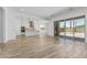 Open-concept living area seamlessly integrates with a modern kitchen and access to the outdoors at 20624 S 216Th Pl, Queen Creek, AZ 85142