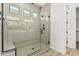 Walk-in shower with stylish vertical tiling and a built-in bench at 20624 S 216Th Pl, Queen Creek, AZ 85142