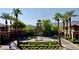 Verado Golf Club entrance with palm trees, fountain, and mountain backdrop at 21240 W Sycamore Dr, Buckeye, AZ 85396