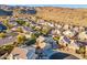 High aerial view of a neighborhood in the mountains with large homes and desert landscaping at 2318 E Granite View Dr, Phoenix, AZ 85048