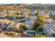 Aerial view of a community showcasing well-maintained homes, green lawns, and sparkling pools at 2318 E Granite View Dr, Phoenix, AZ 85048