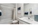 Clean bathroom featuring bathtub, shower with marble tile, and modern vanity at 23997 W Cocopah St, Buckeye, AZ 85326
