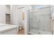 Modern bathroom featuring glass shower, tile flooring, and modern fixtures at 23997 W Cocopah St, Buckeye, AZ 85326