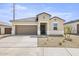 Charming single-story home with a two-car garage and low maintenance desert landscaping at 23997 W Cocopah St, Buckeye, AZ 85326