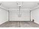 Clean, spacious garage with automatic door opener ready for parking and storage at 23997 W Cocopah St, Buckeye, AZ 85326