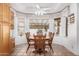 Bright dining area with a view, a round wood table, and ample natural light at 2506 S Acanthus --, Mesa, AZ 85209