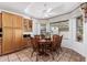 Charming dining area with a round table, decorative lighting, and a window with natural light at 2506 S Acanthus --, Mesa, AZ 85209
