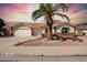 Charming single-story home with a well-manicured yard and a desert landscape at 2506 S Acanthus --, Mesa, AZ 85209