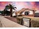 Charming single-story home featuring a well-manicured yard and desert landscaping at 2506 S Acanthus --, Mesa, AZ 85209