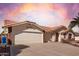 Spacious home featuring a wide driveway, three-car garage, and desert landscaping at 2506 S Acanthus --, Mesa, AZ 85209