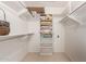 Organized walk-in closet with shelving and hanging rods maximizes storage and space at 2506 S Acanthus --, Mesa, AZ 85209