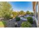 Beautiful backyard with a seating area and mature landscaping at 26648 W Quail Ave, Buckeye, AZ 85396