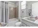 Bathroom featuring a shower-tub combo, neutral walls, vinyl flooring and a single sink vanity at 26648 W Quail Ave, Buckeye, AZ 85396