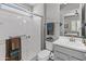 Bathroom with a glass shower, gray cabinets, and a neutral color palette at 26648 W Quail Ave, Buckeye, AZ 85396