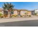 Charming home featuring a tiled roof, two-car garage, desert landscaping, and an arched entryway at 26648 W Quail Ave, Buckeye, AZ 85396