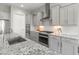 Stylish kitchen with stainless steel appliances, modern cabinetry, and granite countertops at 26648 W Quail Ave, Buckeye, AZ 85396