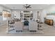 Inviting living room with a media center, comfortable seating, and a ceiling fan for added comfort at 26648 W Quail Ave, Buckeye, AZ 85396