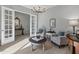 Bright and airy living room featuring French doors and stylish decor at 26648 W Quail Ave, Buckeye, AZ 85396