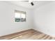 Bedroom displaying a window and wood floors, offering a comfortable, minimalist design at 2908 E Escondido Ave, Mesa, AZ 85204