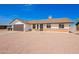 Charming single-story home featuring a brick facade, a brown garage door, and low-maintenance landscaping at 2908 E Escondido Ave, Mesa, AZ 85204