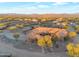 Stunning aerial view of a luxury desert home surrounded by lush desert landscape at 29423 N 145Th Pl, Scottsdale, AZ 85262