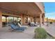Inviting outdoor patio with lounge chairs and spiral staircase, perfect for relaxation at 29423 N 145Th Pl, Scottsdale, AZ 85262