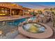 Relax in this backyard with an in-ground spa and large swimming pool at 29423 N 145Th Pl, Scottsdale, AZ 85262