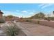 Low maintenance desert landscaped backyard with gravel, pavers, and mature trees at 29423 N 145Th Pl, Scottsdale, AZ 85262