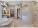 This bathroom features a curved shower, dual sinks, and a separate toilet room at 29423 N 145Th Pl, Scottsdale, AZ 85262