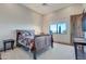 This bedroom features a comfortable bed, a view outside, and a spacious closet at 29423 N 145Th Pl, Scottsdale, AZ 85262