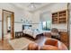 This bedroom features a window nook, a built-in desk, and space for relaxing at 29423 N 145Th Pl, Scottsdale, AZ 85262