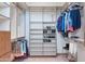 This walk-in closet features custom shelving and ample storage space at 29423 N 145Th Pl, Scottsdale, AZ 85262