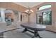 Formal dining room area with elegant light fixture, and a large window with outdoor views at 29423 N 145Th Pl, Scottsdale, AZ 85262