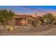 Desert home featuring mature landscaping with native trees and drought resistant plants at 29423 N 145Th Pl, Scottsdale, AZ 85262