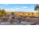 Outdoor fireplace area with comfortable seating, perfect for enjoying the desert evenings at 29423 N 145Th Pl, Scottsdale, AZ 85262