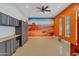 Custom garage with storage cabinets, workbench, and a desert mural wall at 29423 N 145Th Pl, Scottsdale, AZ 85262