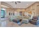Open-concept living area with plush sectional sofa and seamless flow to other spaces at 29423 N 145Th Pl, Scottsdale, AZ 85262