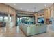 Bright living area with fireplace, entertainment center, and large sliding glass doors at 29423 N 145Th Pl, Scottsdale, AZ 85262