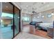 Open and airy main bedroom with a private patio, tray ceiling, and a ceiling fan at 29423 N 145Th Pl, Scottsdale, AZ 85262