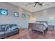 This main bedroom features wood floors, recessed lighting, and tasteful decor at 29423 N 145Th Pl, Scottsdale, AZ 85262