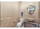 Unique powder room with marble mosaic backsplash, vessel sink, and detailed mirror at 29423 N 145Th Pl, Scottsdale, AZ 85262