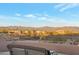 Rooftop patio with a beautiful view of the surrounding desert landscape and mountains at 29423 N 145Th Pl, Scottsdale, AZ 85262