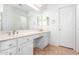 Bright bathroom featuring a double sink vanity, framed mirrors, and tile flooring at 4016 E Forest Pleasant Pl, Cave Creek, AZ 85331