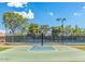 Community basketball court with surrounding fence lines and lighting against a blue sky at 4102 E Cathedral Rock Dr, Phoenix, AZ 85044