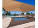 Relaxing community pool and spa area with ample seating, shaded by a large canopy for sun protection at 4102 E Cathedral Rock Dr, Phoenix, AZ 85044