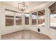 Bright dining area features tile flooring, multiple windows, and a modern light fixture at 4102 E Cathedral Rock Dr, Phoenix, AZ 85044