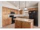 Well-lit kitchen boasts a large island, stainless steel appliances, and granite countertops at 4102 E Cathedral Rock Dr, Phoenix, AZ 85044