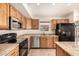 Modern kitchen features stainless steel appliances and granite countertops at 4102 E Cathedral Rock Dr, Phoenix, AZ 85044