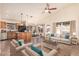 Open-concept living room and kitchen with vaulted ceilings, an island, and modern decor at 4102 E Cathedral Rock Dr, Phoenix, AZ 85044